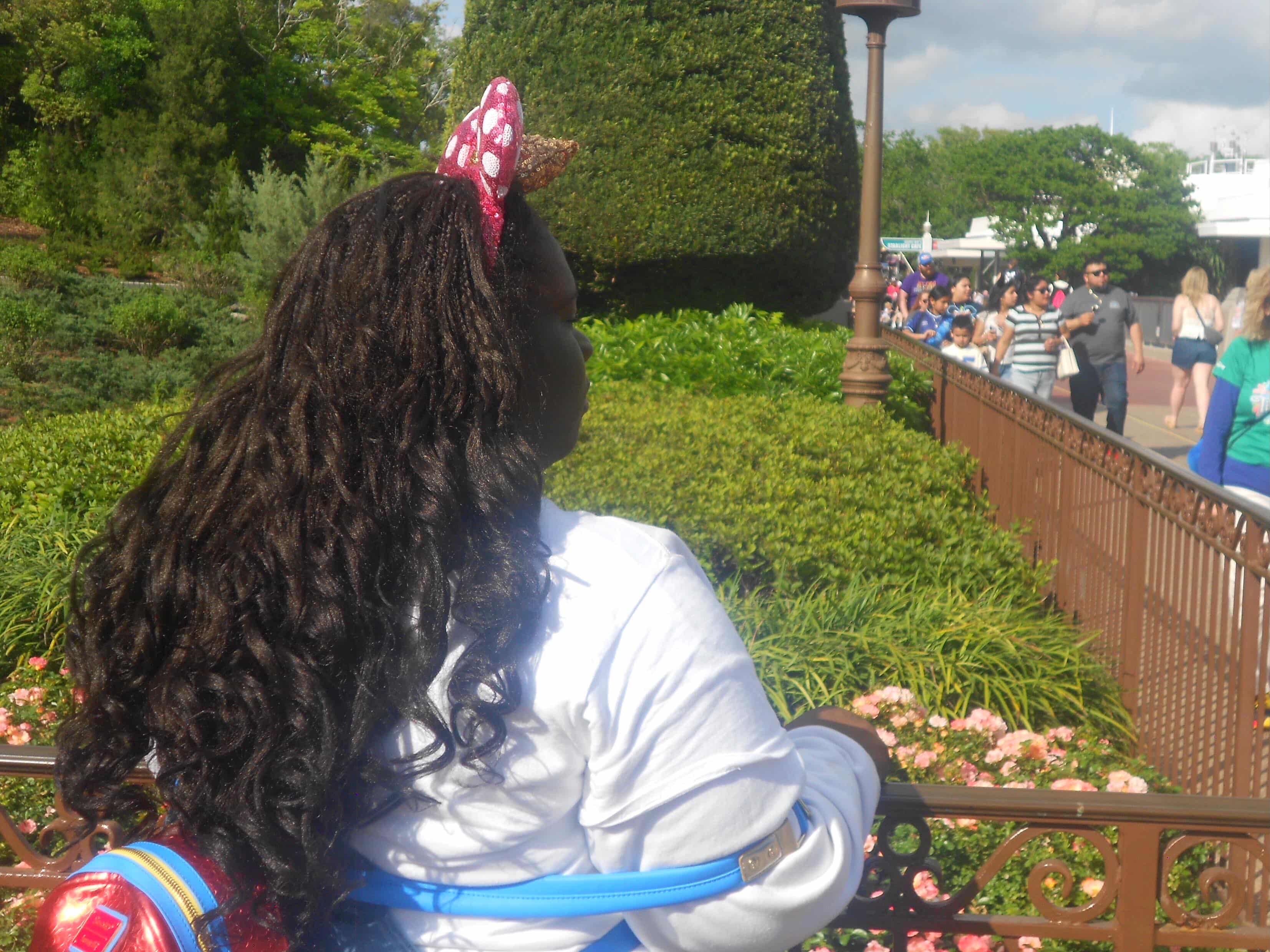 Becki wearing Minnie ears on a sunny day